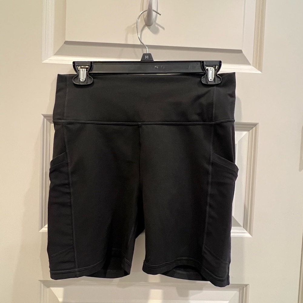 Fabletics Powehold Black High-Rise Bike Shorts with Side Pockets